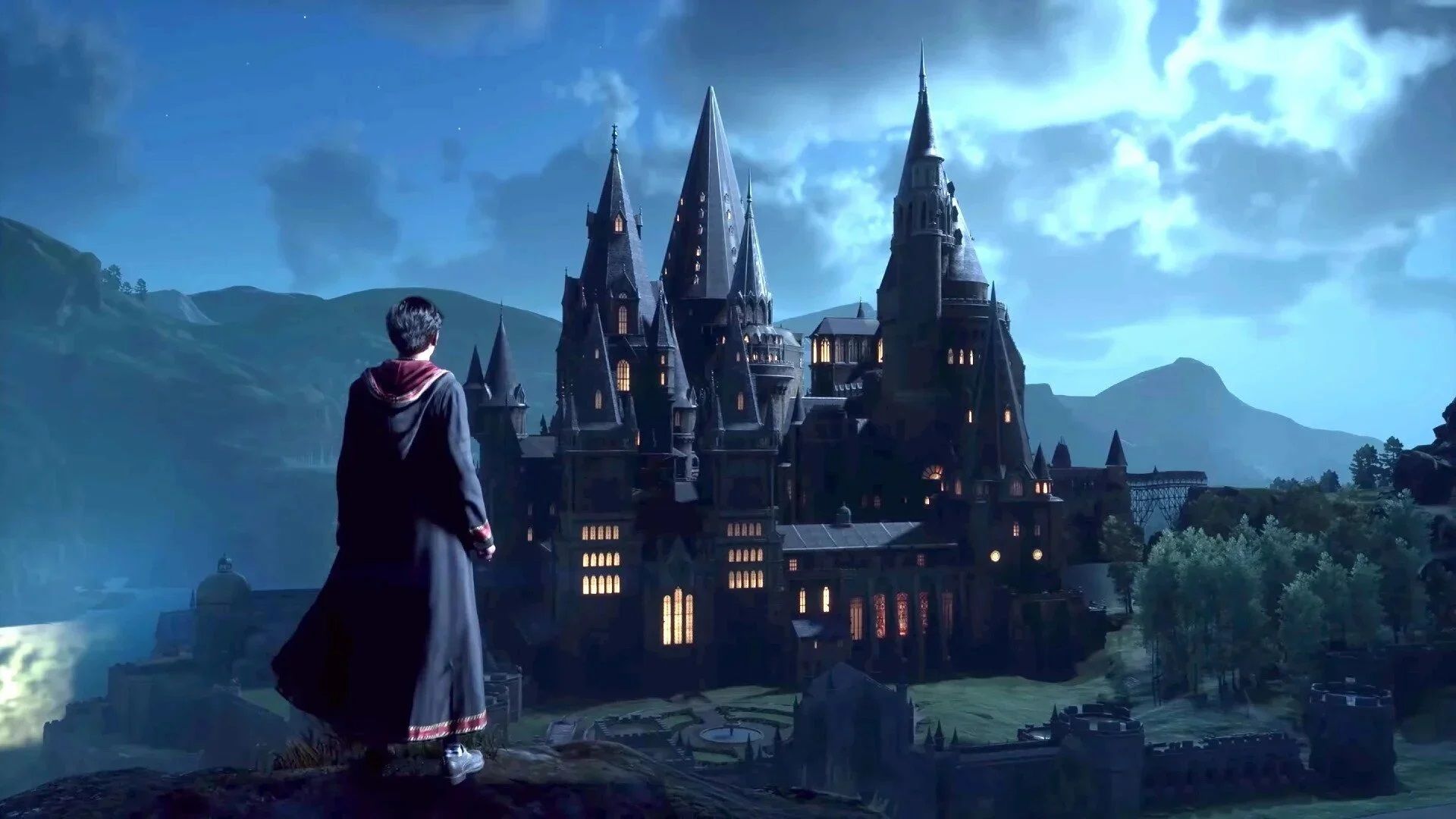 2024-1-hogwarts-legacy-66cc7d112b5676090d02db1c-1 پسر جادوگر در مقابل چشمانداز قلعه هاگوارتز در بازی Hogwarts Legacy