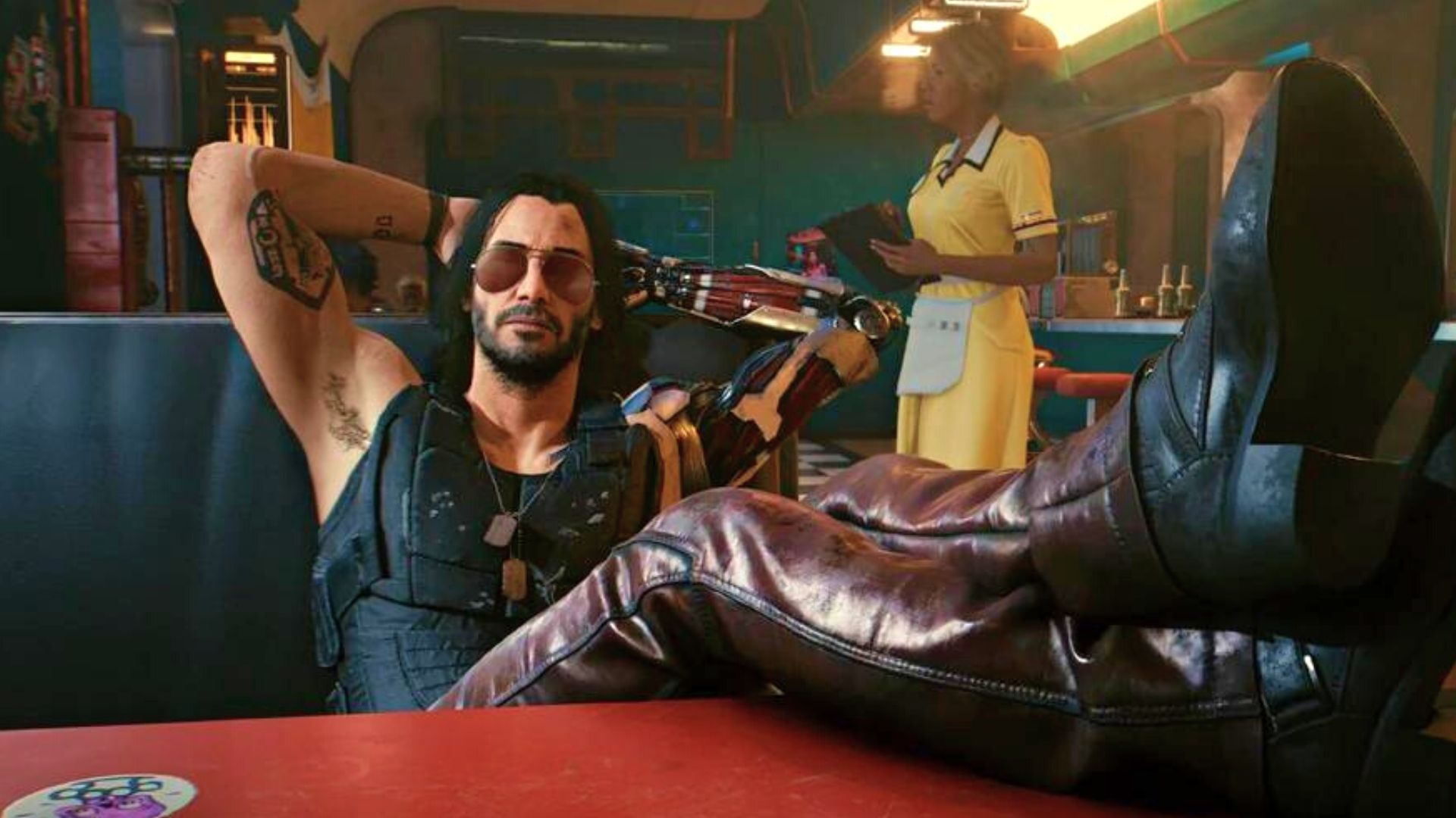 2024-7-cyberpunk-2077-66cc7d122b5676090d02f4e6-1 لم دادن جانی سیلورهند روی مبل یک غذاخوری در بازی Cyberpunk 2077